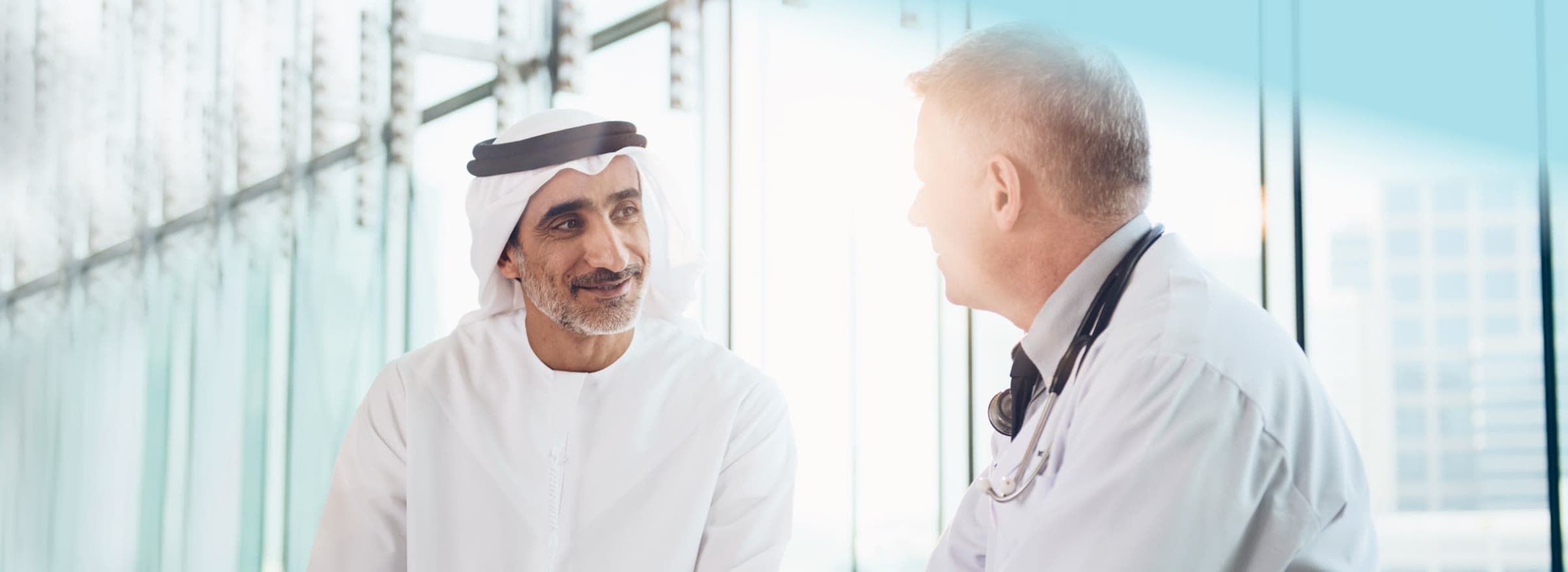 A patient in conversation with a physician at Cleveland Clinic Abu Dhabi